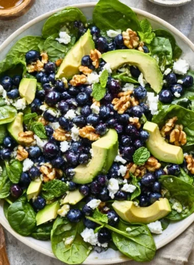 Delicious spinach blueberry salad with vibrant ingredients in a bowl
