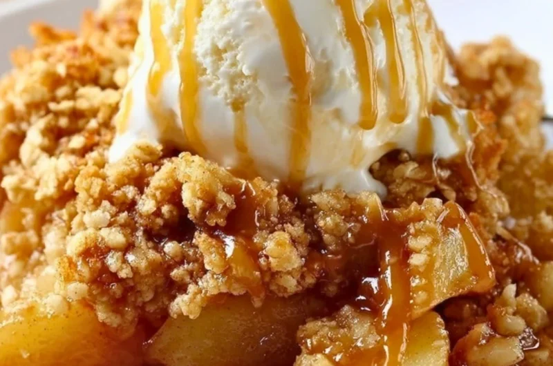 Delicious baked apple crumble served warm with a golden oat topping