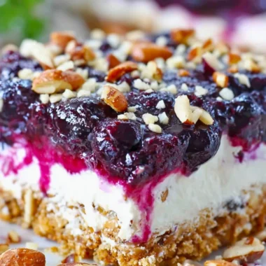 Delicious Blueberry Pretzel Salad with blueberries, cream, and pretzel crust
