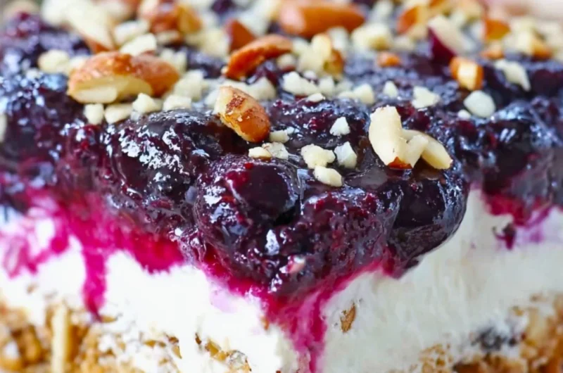 Delicious Blueberry Pretzel Salad with blueberries, cream, and pretzel crust