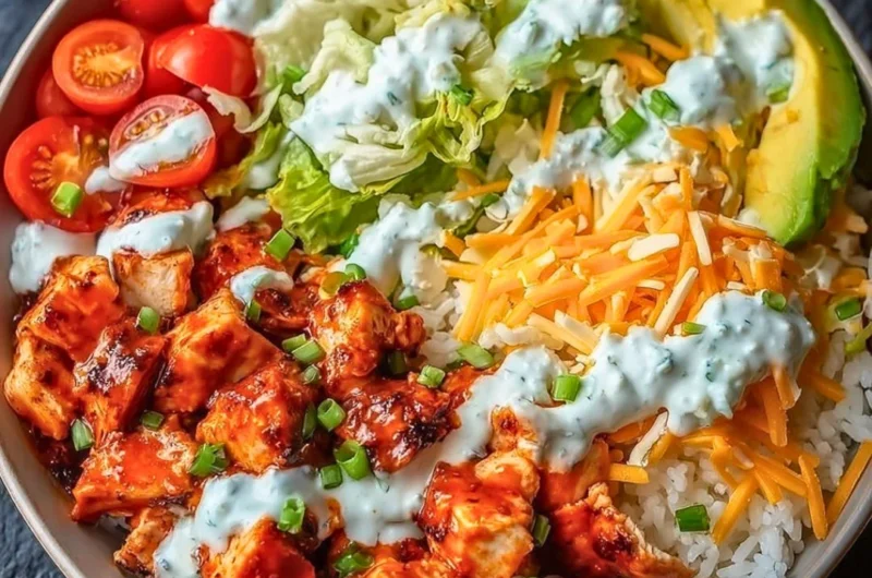 Delicious Buffalo Chicken Bowl topped with fresh ingredients and tangy sauce