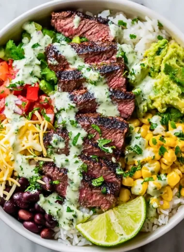 Cilantro lime steak bowl with fresh vegetables and steak slices
