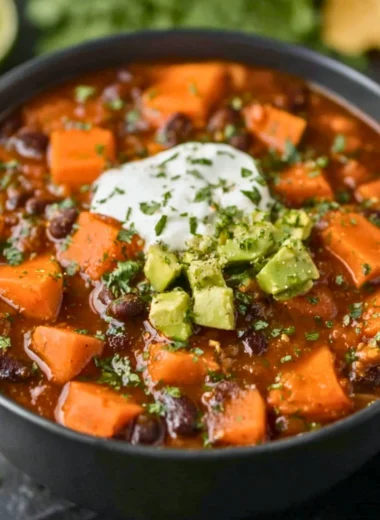 A bowl of delicious Crock Pot sweet potato black bean chili garnished with cilantro.