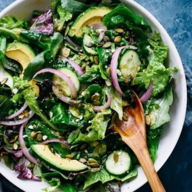 Fresh and colorful everyday salad with greens, vegetables, and dressing