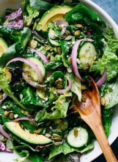 Fresh and colorful everyday salad with greens, vegetables, and dressing