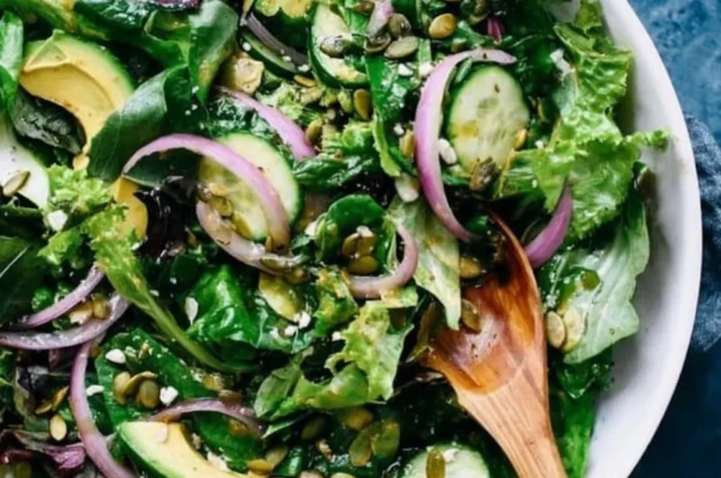 Fresh and colorful everyday salad with greens, vegetables, and dressing