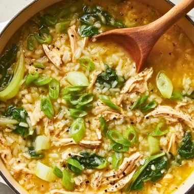 Ginger chicken and rice soup with bok choy in a bowl