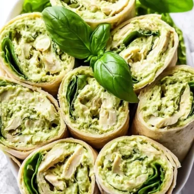 Healthy and easy pesto chicken salad served in a bowl with fresh ingredients