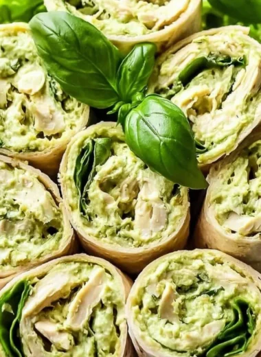 Healthy and easy pesto chicken salad served in a bowl with fresh ingredients