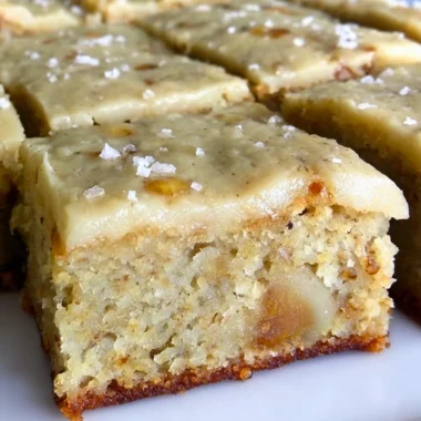 Delicious banana bread brownies with brown butter frosting on a plate