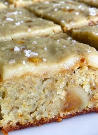 Delicious banana bread brownies with brown butter frosting on a plate