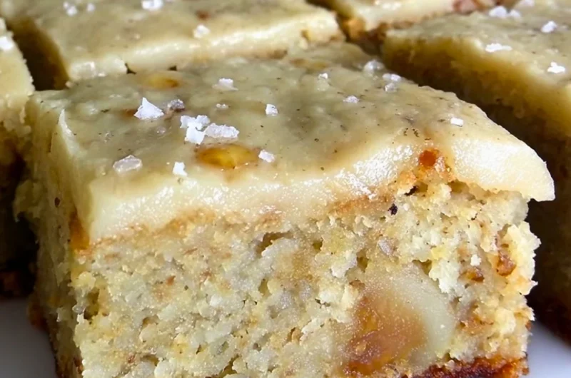 Delicious banana bread brownies with brown butter frosting on a plate