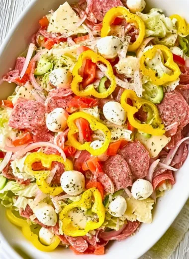 Two variations of a vibrant Italian Sub Salad with fresh ingredients