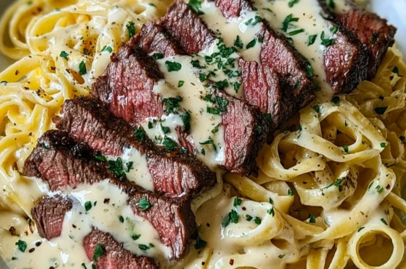 Plate of savory Steak Gorgonzola Alfredo with creamy Parmesan sauce