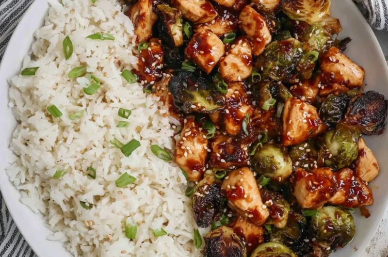 Air fried chicken breast served with Brussels sprouts on a white plate