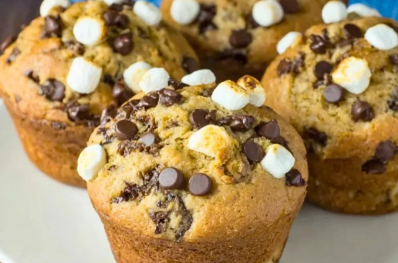 Freshly baked Banana S'mores Muffins with chocolate and marshmallows
