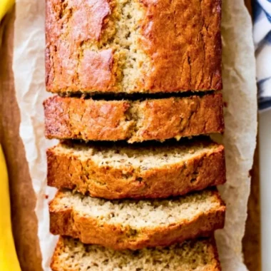 Delicious slice of homemade banana bread with ripe bananas