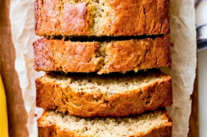 Delicious slice of homemade banana bread with ripe bananas