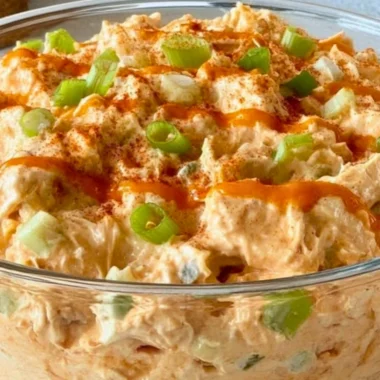 Delicious Buffalo Chicken Salad with spicy chicken, fresh greens, and toppings