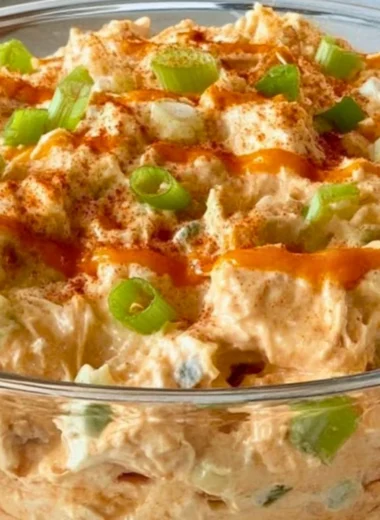 Delicious Buffalo Chicken Salad with spicy chicken, fresh greens, and toppings