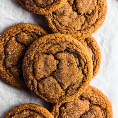 Chewy pumpkin spice molasses cookies on a rustic wooden table