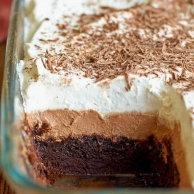 Decadent Chocolate French Silk Brownies topped with chocolate ganache and whipped cream