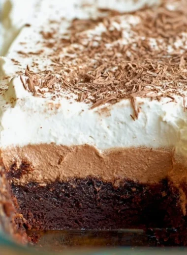 Decadent Chocolate French Silk Brownies topped with chocolate ganache and whipped cream