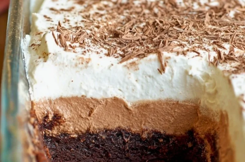 Decadent Chocolate French Silk Brownies topped with chocolate ganache and whipped cream