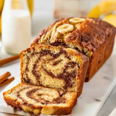 Delicious homemade cinnamon swirl banana bread loaf, fresh out of the oven.
