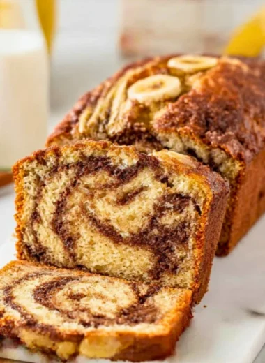 Delicious homemade cinnamon swirl banana bread loaf, fresh out of the oven.