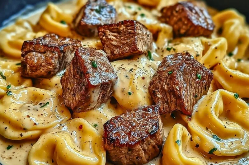 Cracked garlic steak tortellini in creamy sauce served on a plate