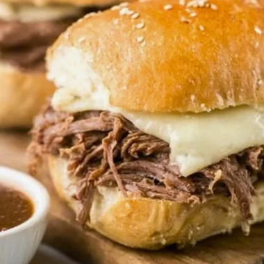 Crock Pot French Dip sandwich served with au jus sauce