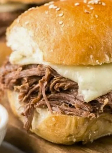 Crock Pot French Dip sandwich served with au jus sauce