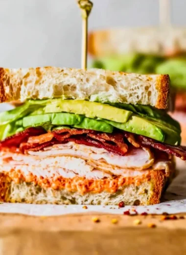 Delicious easy turkey club sandwich stacked with turkey, bacon, lettuce, and tomato.