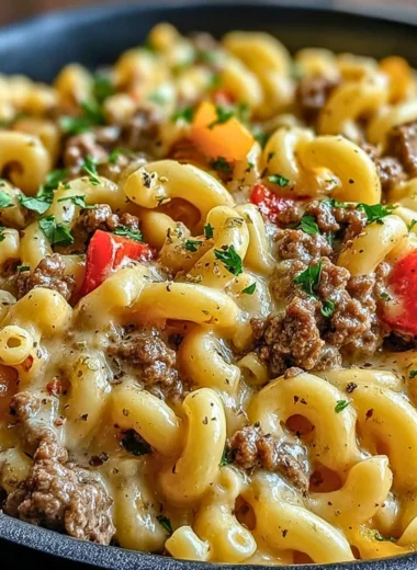 High-protein creamy Philly cheesesteak mac and cheese topped with herbs and cheese