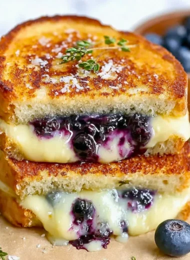 Juicy blueberry grilled cheese sandwich with melted cheese and fresh blueberries