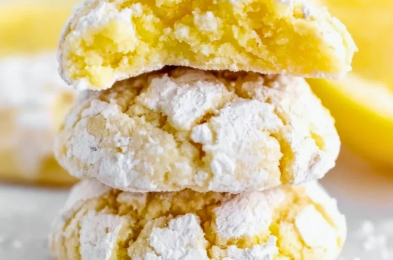 Freshly baked Lemon Crinkle Cookies dusted with powdered sugar