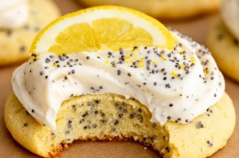 Lemon poppy seed cookies decorated with creamy cheesecake frosting.