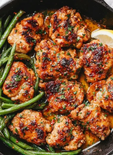 Skillet Garlic Butter Chicken with green beans served in a skillet.