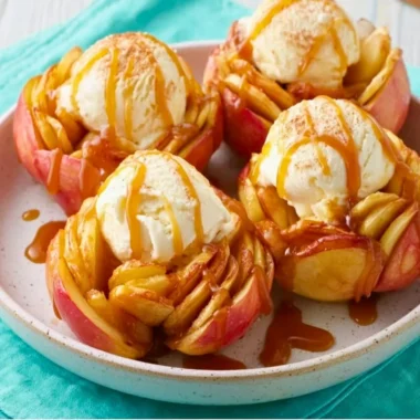 Slow cooker bloomin' baked apples topped with cinnamon and caramel sauce