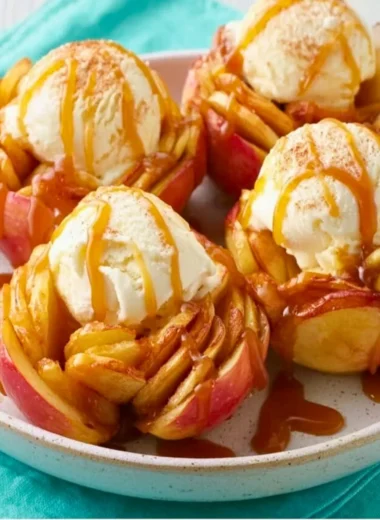 Slow cooker bloomin' baked apples topped with cinnamon and caramel sauce
