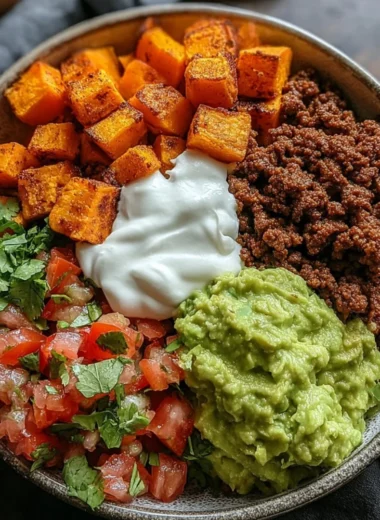 Colorful sweet potato taco bowl with fresh toppings and vibrant ingredients