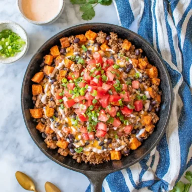 Turkey Sweet Potato Skillet with vibrant vegetables in a cast-iron pan