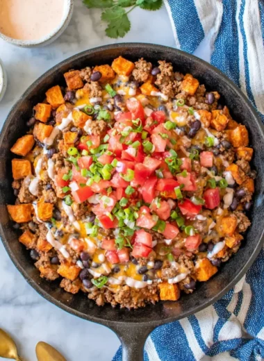 Turkey Sweet Potato Skillet with vibrant vegetables in a cast-iron pan
