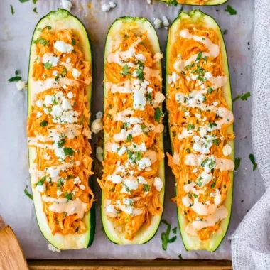 Buffalo Chicken Stuffed Zucchini Boats filled with spicy chicken and cheese