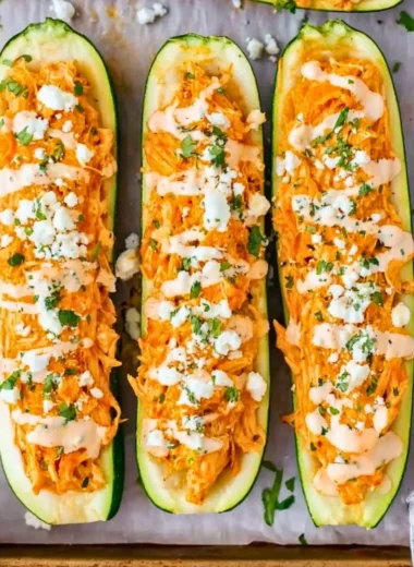 Buffalo Chicken Stuffed Zucchini Boats filled with spicy chicken and cheese
