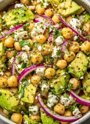 Chickpea Feta Avocado Salad with vibrant vegetables in a bowl