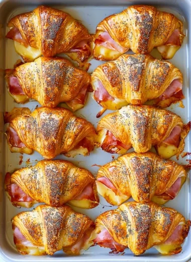 Dijon-honey ham and cheese mini croissant sandwiches on a serving platter