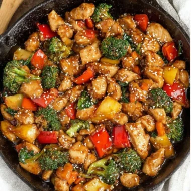 A colorful easy chicken stir fry with vegetables on a plate.