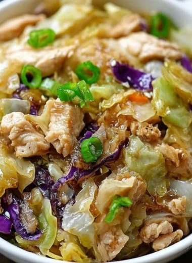 Delicious egg roll bowls featuring chicken, cabbage, and vibrant toppings.